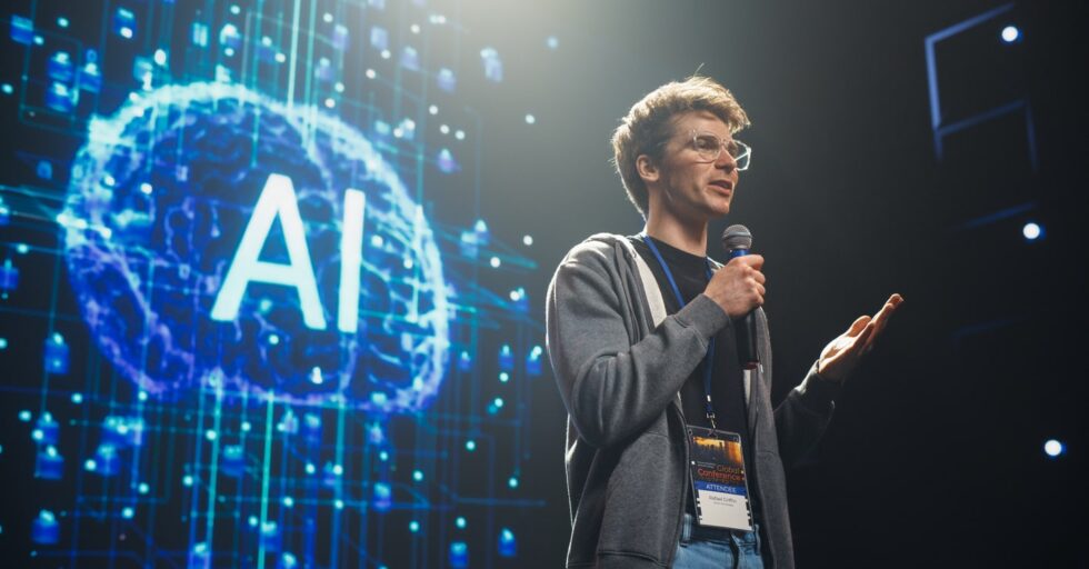 AI Startup Founder Talking About Innovations in the World of Artificial Intelligence and Large Language Models. Young Caucasian Man Talking About Future Technology Insights on Stage at a Global Event